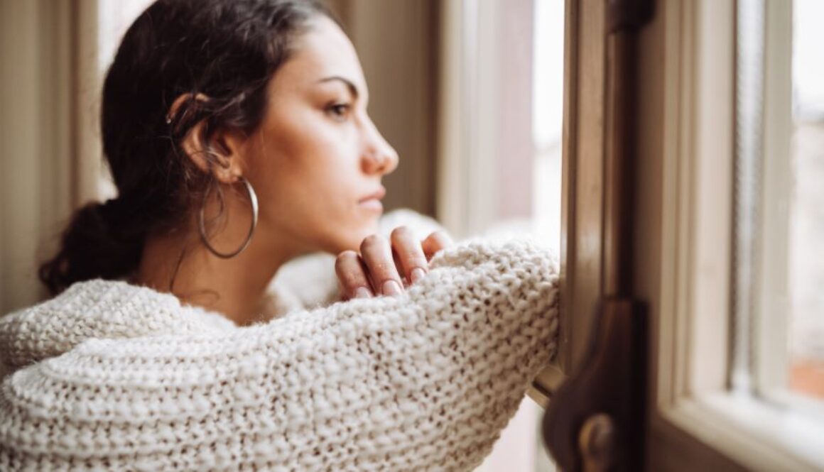 pensive-woman-in-front-of-the-window